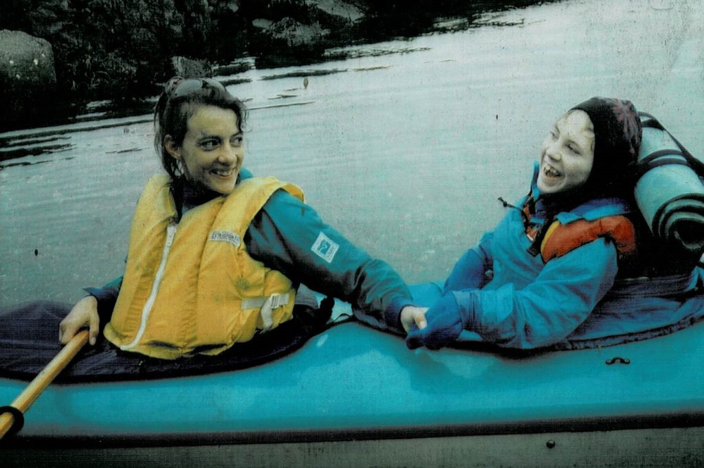 A woman with a disability and her sister kayaking
